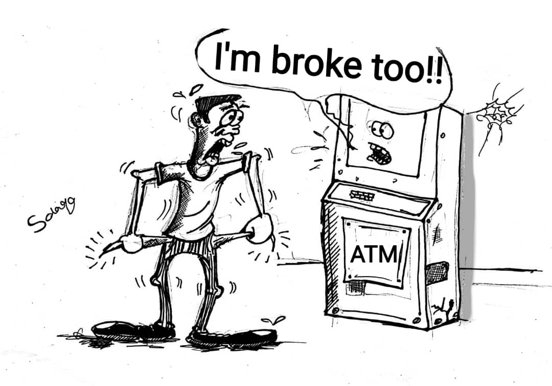 A person with empty pockets faces an ATM that says I’m broke too